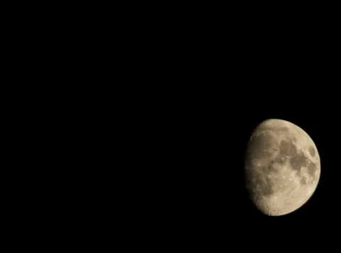 Moon in the black sky. three fourth rounds. Stock Photos