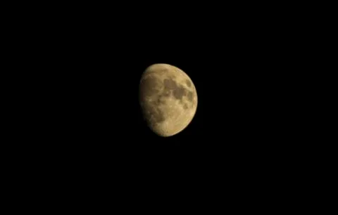 Moon in the black sky. three fourth rounds. Stock Photos