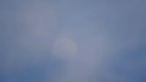 Moon on blue sky and cloud moving on daytime Stock-Footage 129779879