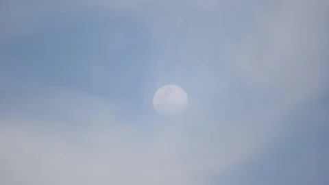 Moon on blue sky and cloud moving on daytime Stock Footage 129780299