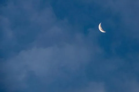 The moon, the blue sky and clouds Stock Photos