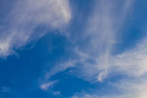 Moon on blue sky with clouds Stock Photos