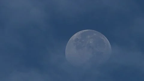Moon in blue sky with drifting clouds Vídeo Stock 249567155