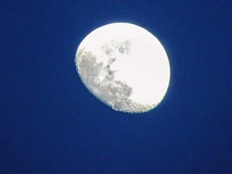 The moon in the blue sky Stock Photos
