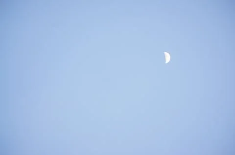 Moon in the blue sky Stock Photos