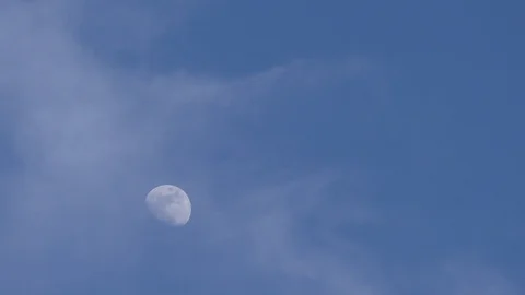 Moon in the blue sky. TimeLapse. Stock Footage 90393196
