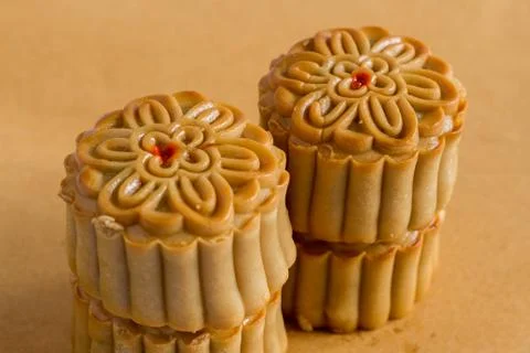 Moon cake on brown background Stock Photos