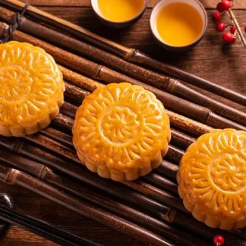 Moon cake Mooncake table setting - Round shaped Chinese traditional pastry wi 写真素材