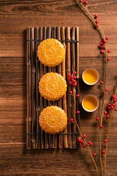 Moon cake Mooncake table setting - Chinese traditional pastry with tea cups.. Stock Photos