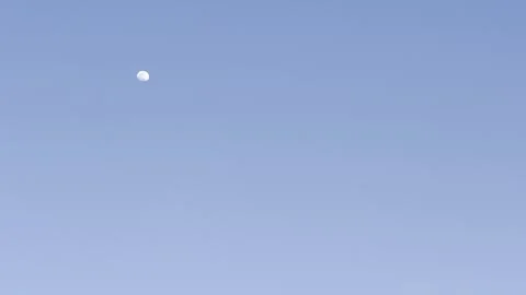 Moon in Clear Blue Evening Sky Video stock 344807559