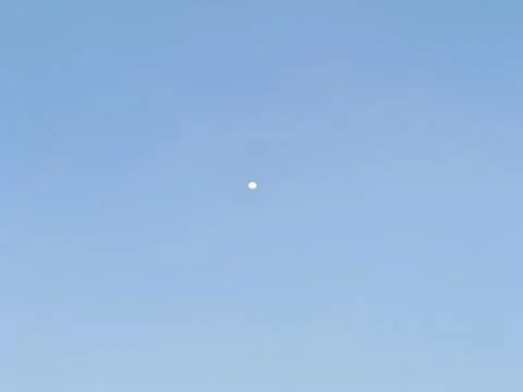Moon in Clear Blue Sky Stock Photos