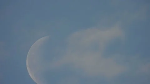 Moon close-up and clouds on blue sky time lapse. Stock Footage 154060536