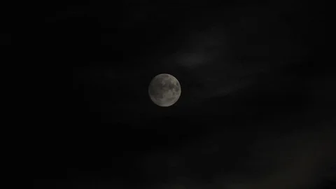 Moon with clouds moving on sky, 4k closeup video at night Video stock 99964754