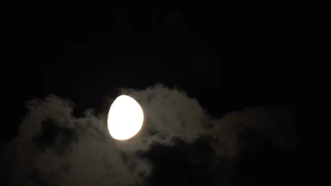 Moon with clouds moving on sky, 4k closeup video at night Stock Footage 99964791