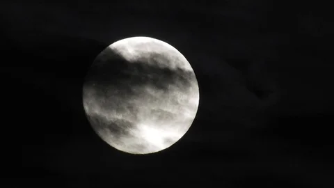 Moon with clouds moving on sky, 4k closeup video at night Video stock 99964850