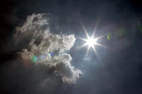 Moon on cloudy day Stock Photos