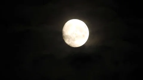 Moon in cloudy night sky. Close up  4k video Stock Footage 95441823