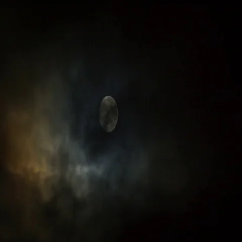 Moon on cloudy sky 4k timelapse Stock Footage 69662403