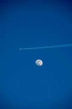 Moon with contrails Stock Photos