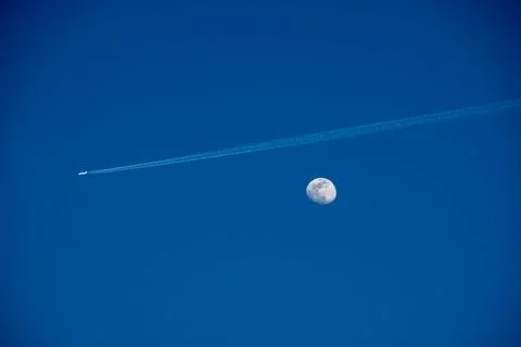 Moon with contrails Stock Photos
