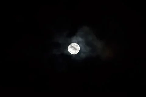 Moon covered in black clouds Stockfoto's