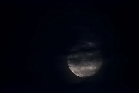 The moon covered with clouds , in the sky Stock Photos