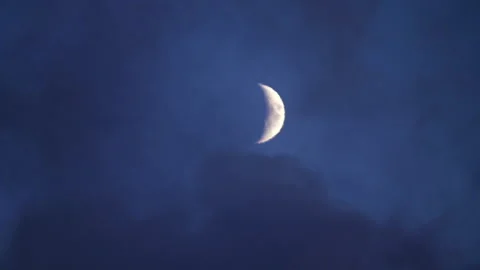 The moon is covered with thick smoke in the night sky. Clouds in the night. Stock Footage 99580895