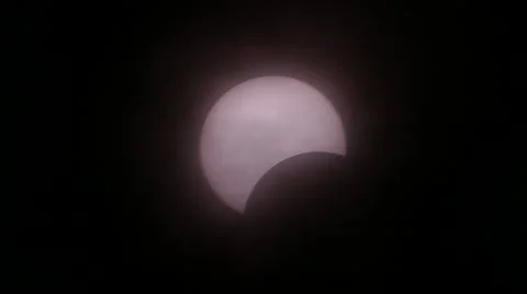 The Moon covering the Sun of partial eclipse, astronomical phenomenon. Stock Footage 61128520