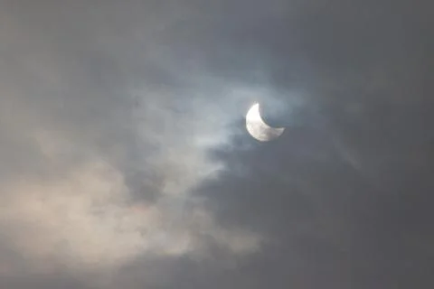 The Moon covering the Sun in a partial eclipse. Fotos Stock