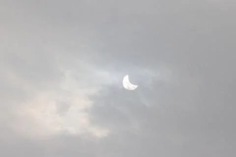 The Moon covering the Sun in a partial eclipse. Fotos Stock