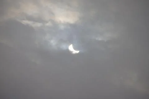 The Moon covering the Sun in a partial eclipse. Fotos Stock