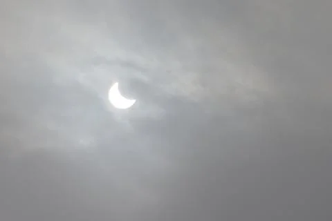 The Moon covering the Sun in a partial eclipse. Fotos Stock