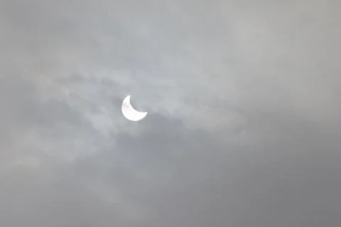 The Moon covering the Sun in a partial eclipse. Fotos Stock