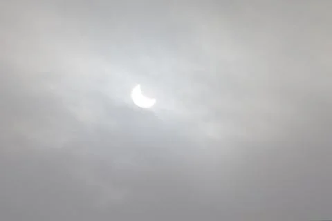 The Moon covering the Sun in a partial eclipse. Fotos Stock