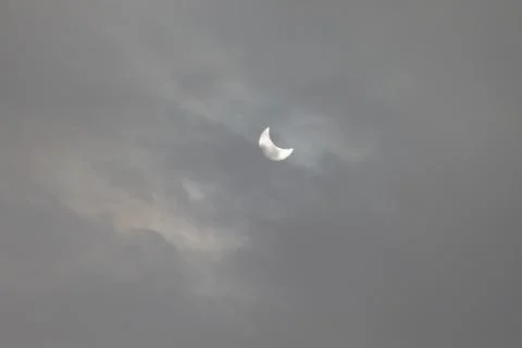 The Moon covering the Sun in a partial eclipse. Fotos Stock