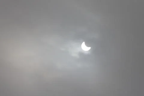 The Moon covering the Sun in a partial eclipse. Fotos Stock