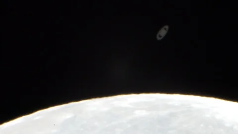 Moon covers Saturn, an amazing view of the night sky and our planets Vídeos de archivo 112945083