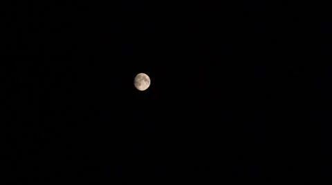 Moon cross the sky pan Stock Footage 39249824