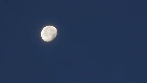 The moon crosses the sky at dawn. Time lapse Stock Footage 78763066