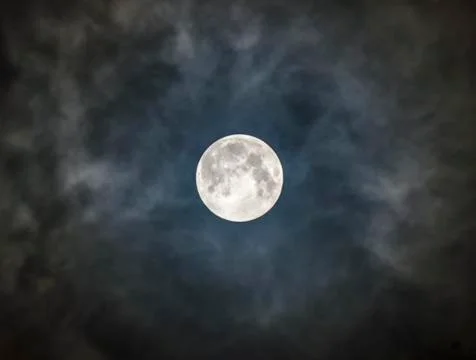 Moon in a dark, cloudy night Foto stock