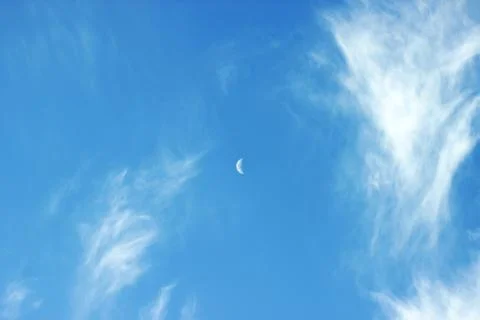 Moon In Day Sky With Clouds Stock Photos