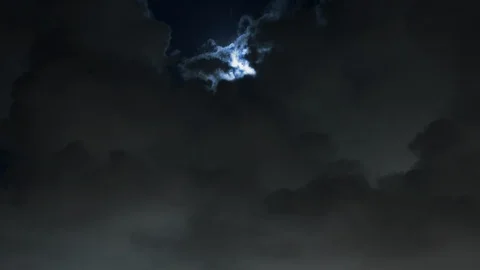 Moon drops in on spectacular lightning storm night timelapse 4K Stock Footage 108393551