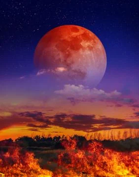 Moon eclipse. Landscape of sky with supermoon and many stars above the fire. Stock-Fotos