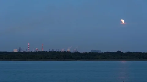 Moon eclipse over the industrial zone in Dabrowa Gornicza. Timelapse Stock Footage 93147849