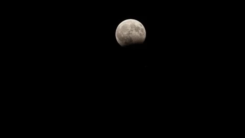 Moon eclipse taken in the initial and final phases Stock Footage 78632842
