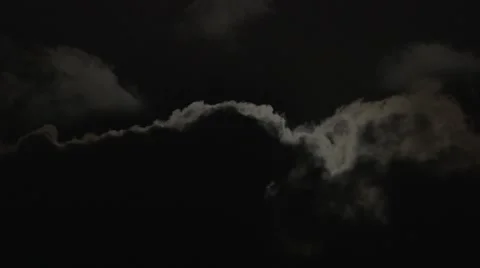 Moon Emerging Behind Clouds Stock Footage