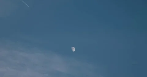 Moon Encounter Jet Airplane Passing Fuel Trail Against Blue Sky Aircraft Fligh Video stock 69182543