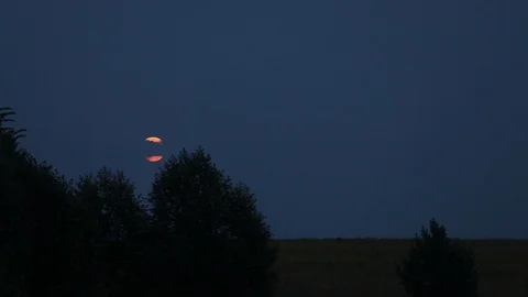 The moon in the evening sky. The clouds are floating on the moon. moon rise Stock Footage 94419858