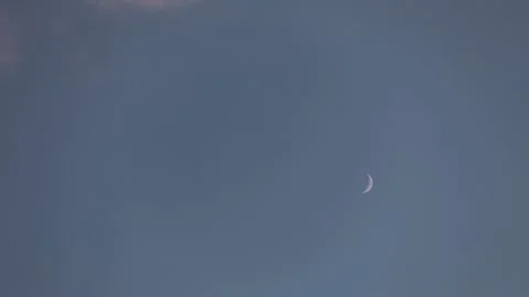 The moon in the evening sky. Clouds floating in the sky at sunset Stock Footage 131451458