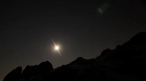 Moon falling over mountains Stock Footage 32349227